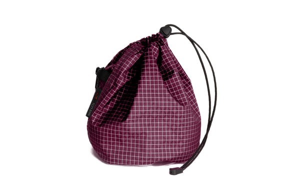 A Medium, clear-bottomed Yarn Stuff Sack in Acai (dark purple with white grid) 200 Halcyon.